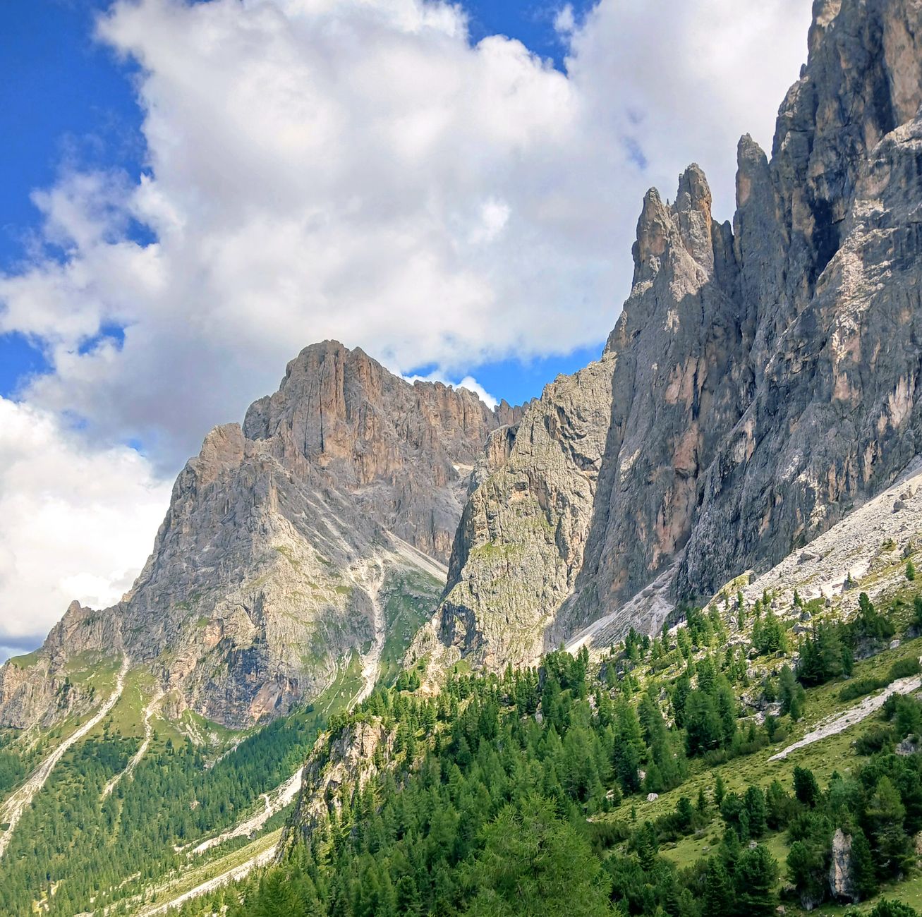 Dolomite mountain cliffs rising into misty skies